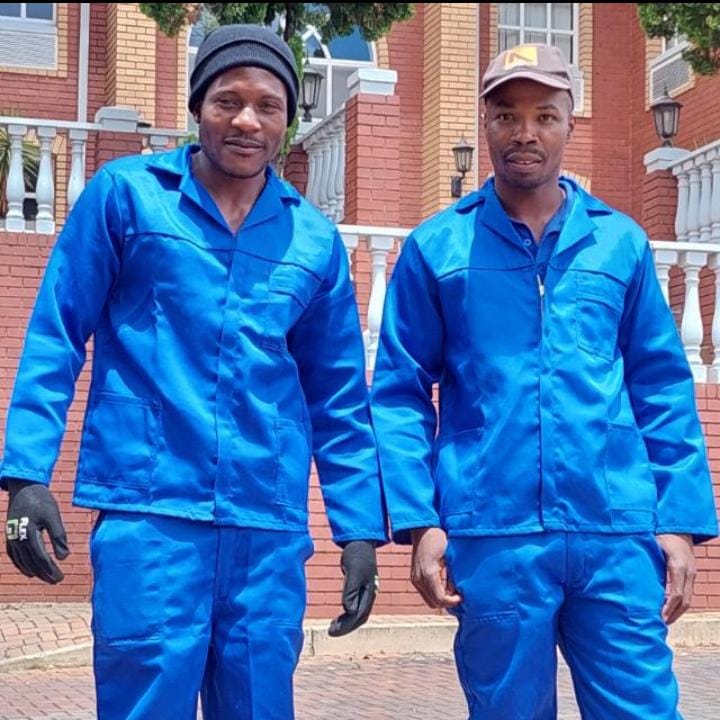our team in clean blue worksuits